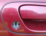016 EXTERIOR - front passenger door lock trim damage.jpg